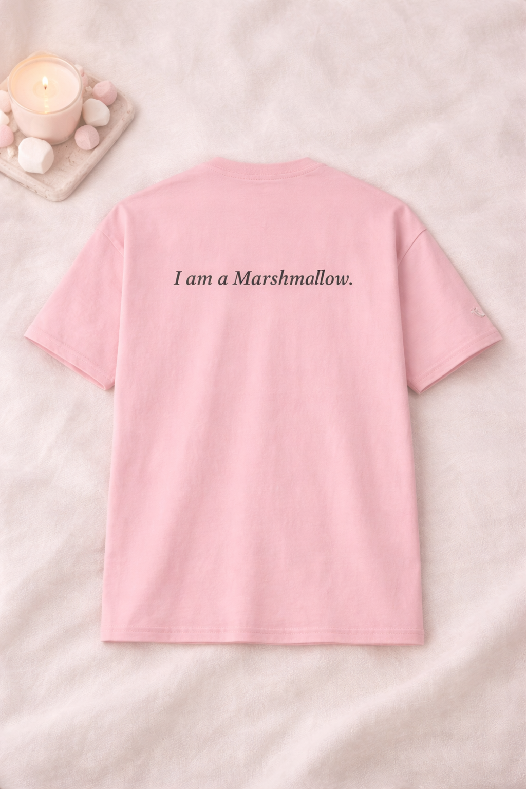 Pink t-shirt with 'I am a Marshmallow' text on a light pink background